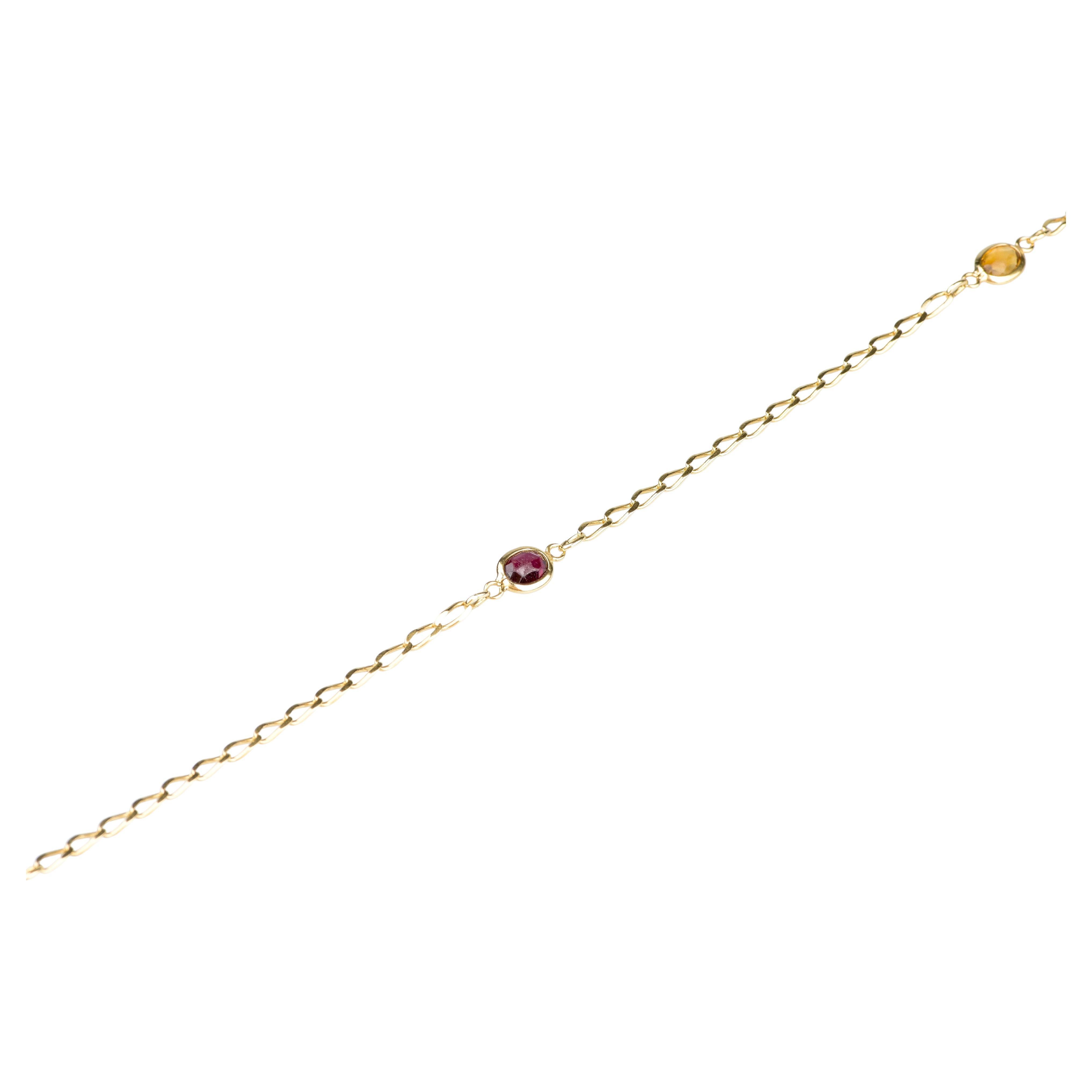  18 carat yellow gold double turn bracelet designed with 5 semi-precious stones