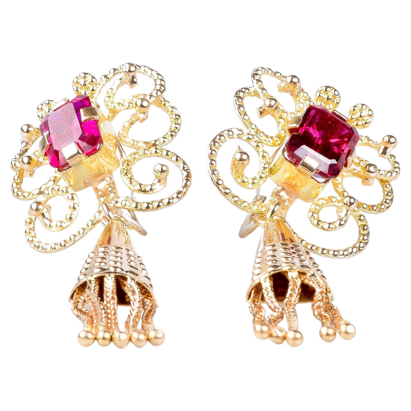 18 carat yellow gold earrings designed with 1.60 carat rubies