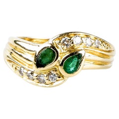 anillo oro amarillo 18 quilates esmeraldas diamantes