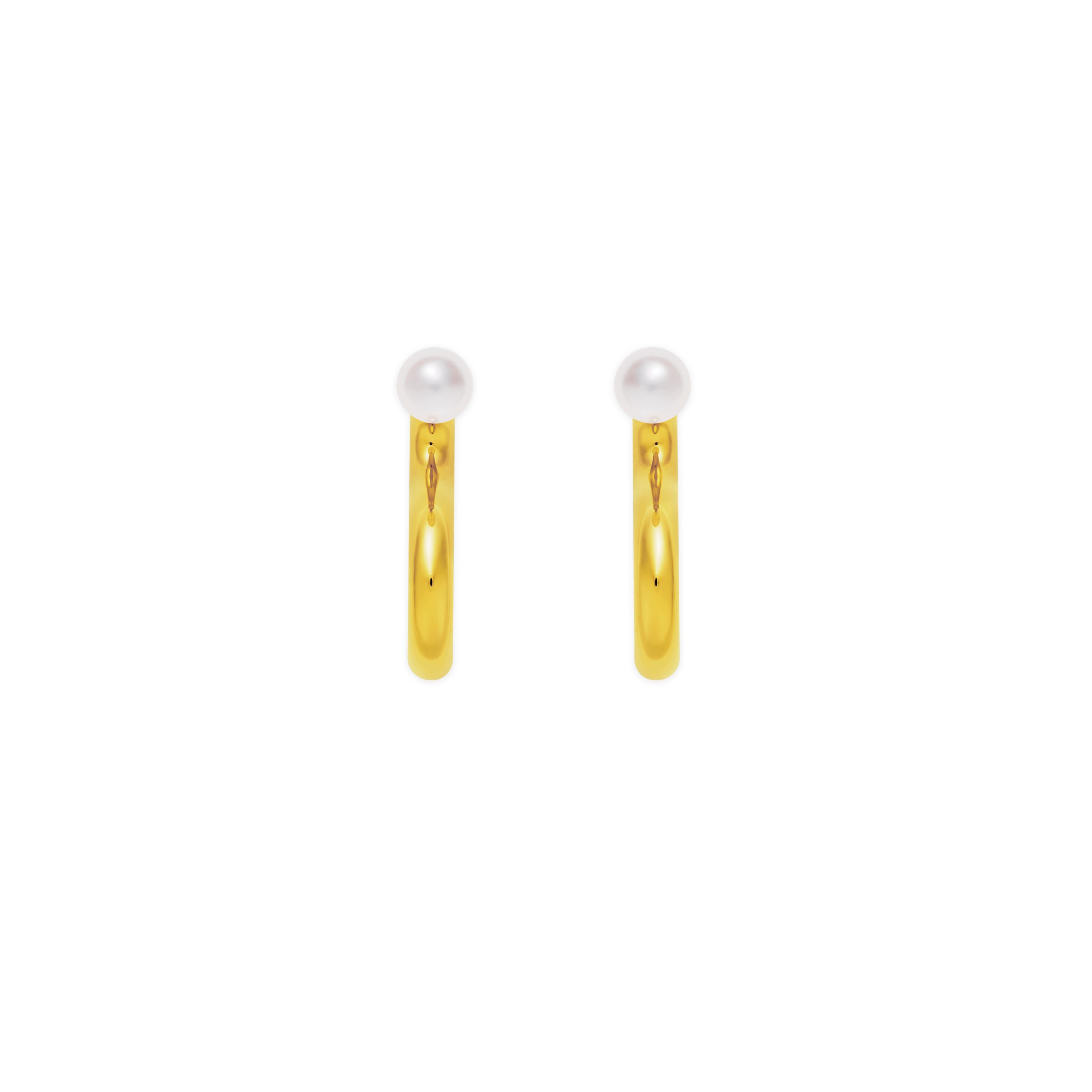 Mistova's Energetic Pearl earrings are a new take one the classic pearls. The tubular design is hollowed out make the earrings light weight and easy to wear daily. Made from the finest 18K gold and real pearls. These earrings are modernist and