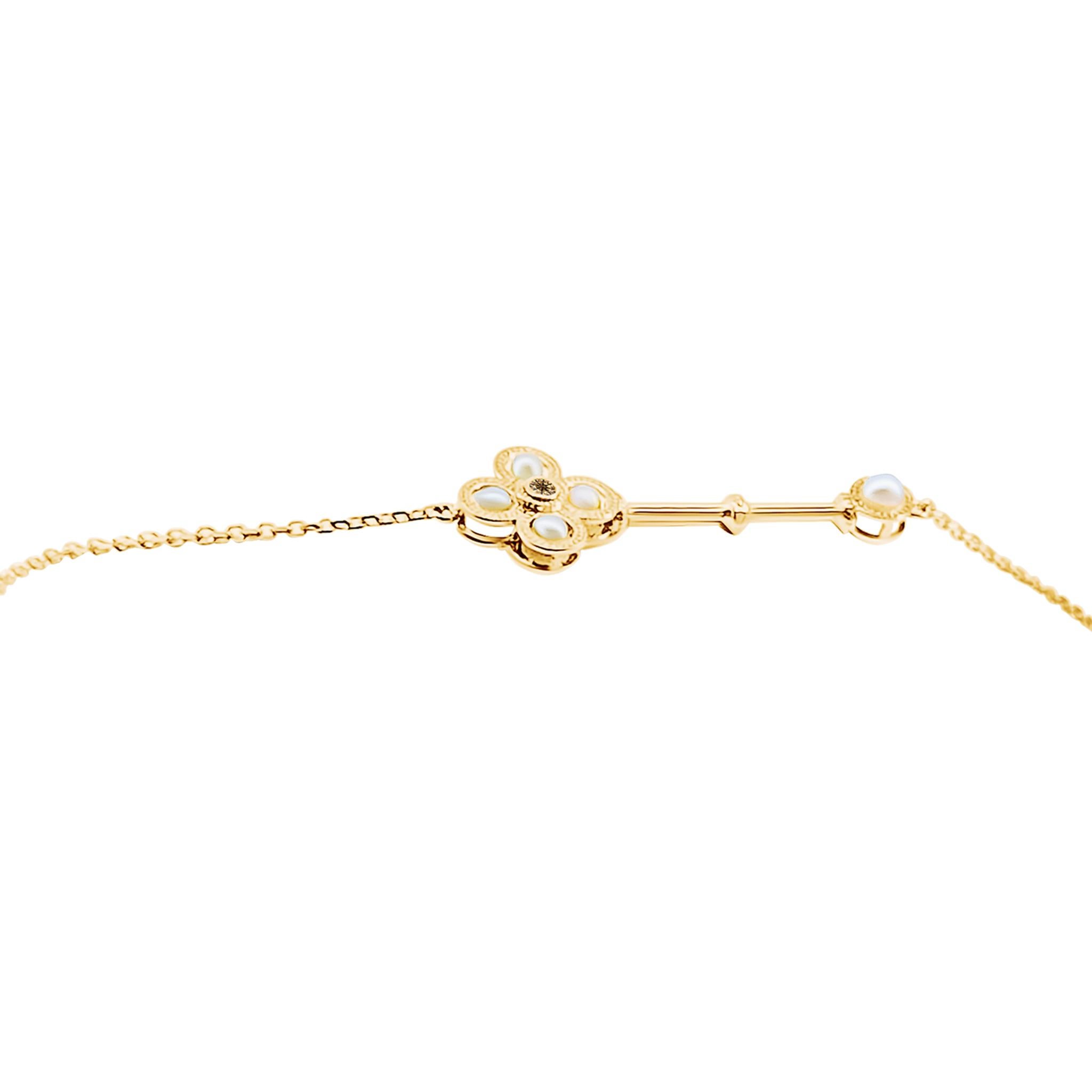 18 Carat Yellow Gold Key Bracelet with Pearl Detail For Sale 1