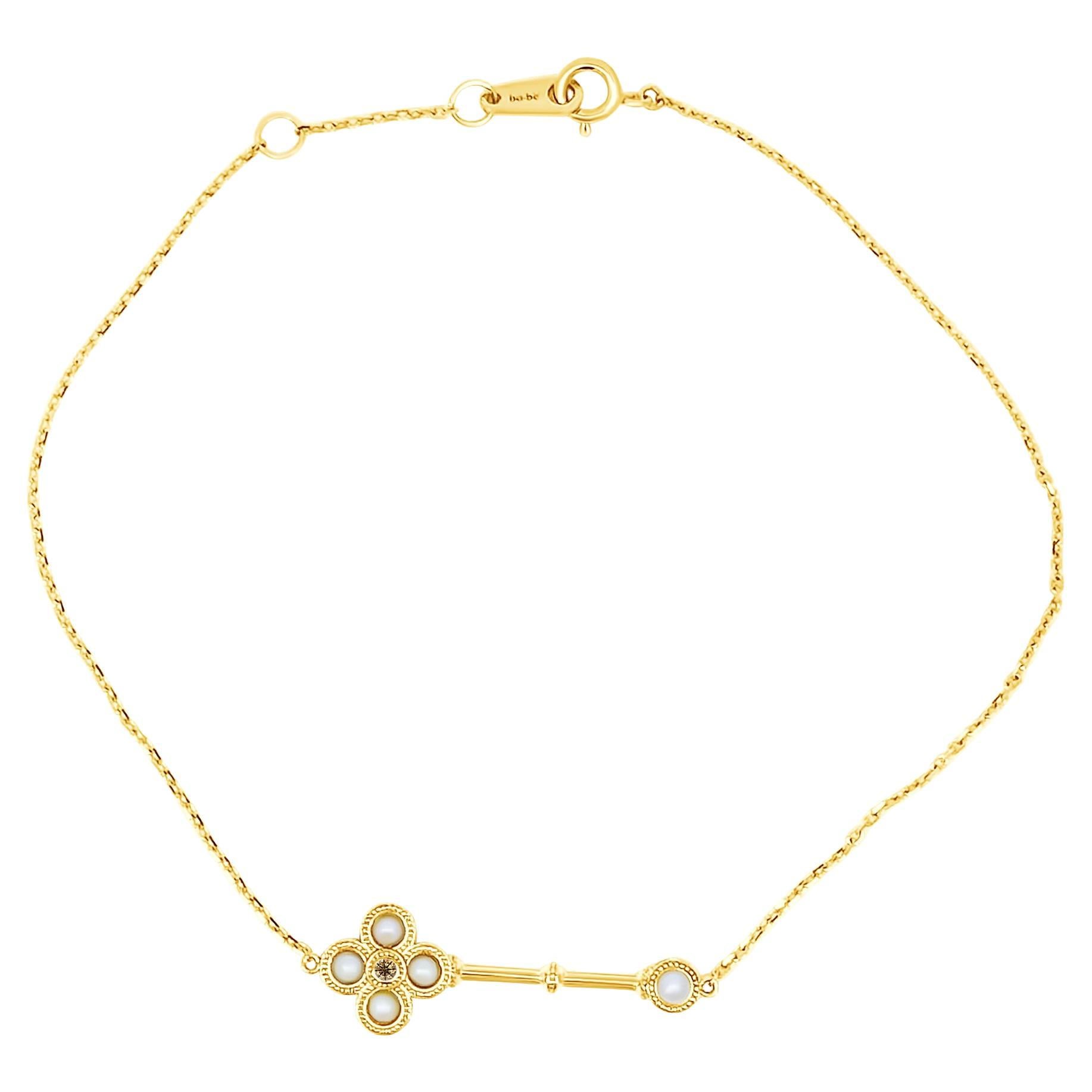 18 Carat Yellow Gold Key Bracelet with Pearl Detail