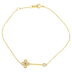 18 Carat Yellow Gold Key Bracelet with Pearl Detail