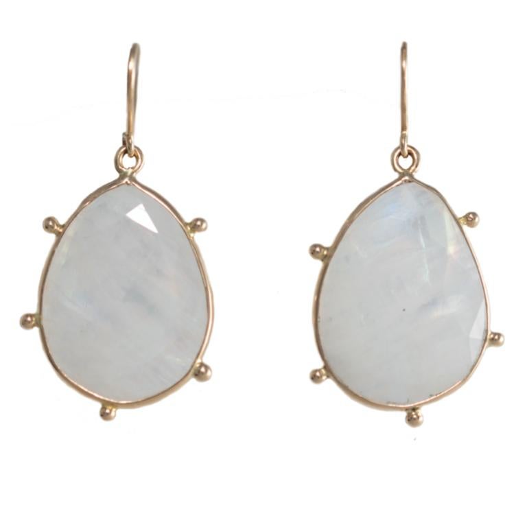 18 Carat Yellow Gold Moonstone Earrings.

Esther Eyre has been designing and making precious jewellery for over twenty years. She trained at Kingston and Middlesex gaining a BA in jewellery design in 1982. Esther worked briefly in Mappin & Webb