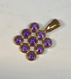 18 Carat Yellow Gold Pendant Set with 9 Amethysts