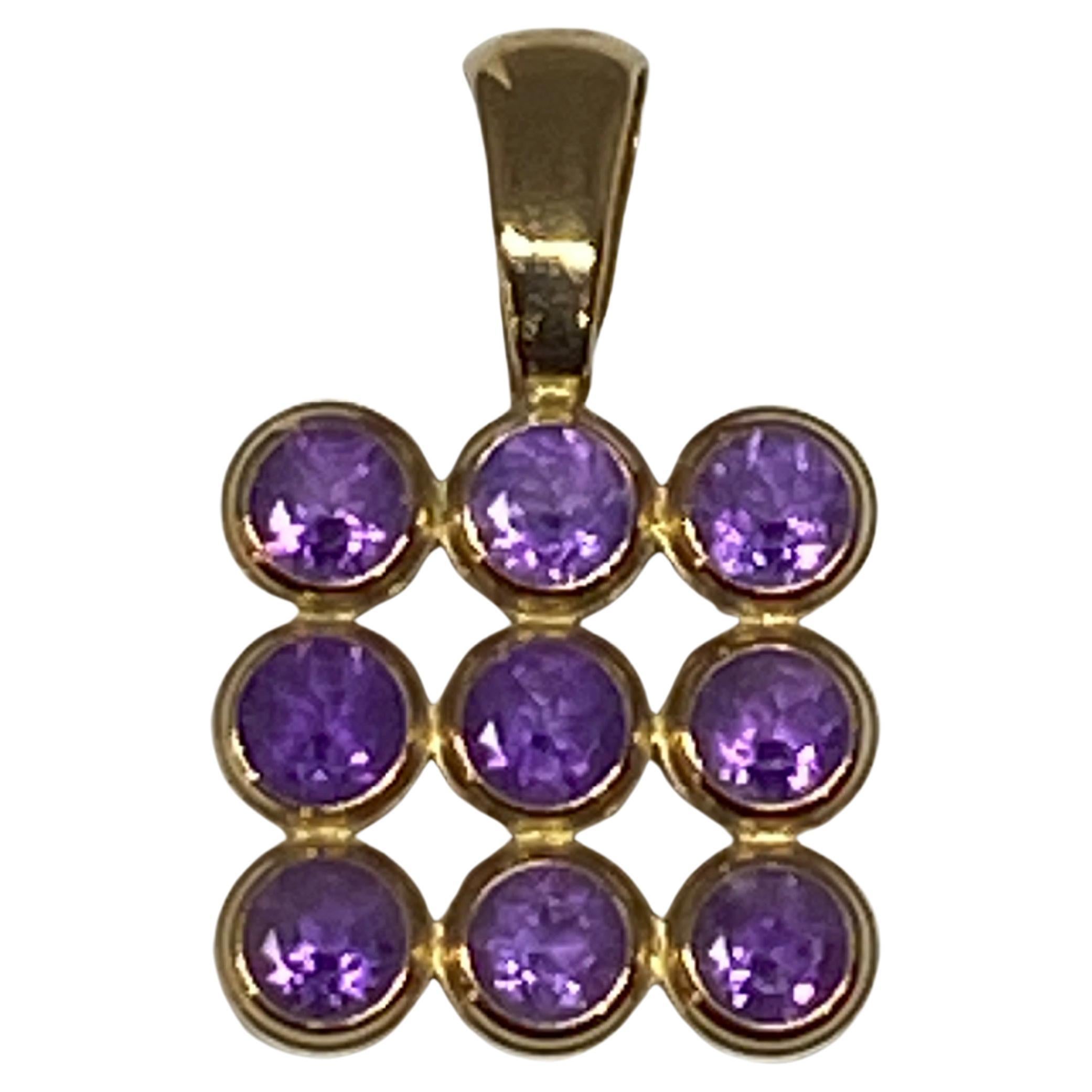 18 Carat Yellow Gold Pendant Set with 9 Amethysts For Sale