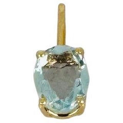 18 carat yellow gold pendant with oval facetted aquamarine