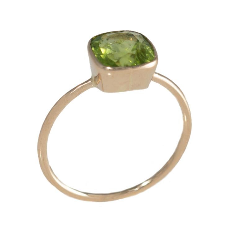 18 Carat Yellow Gold Peridot Ring.

Esther Eyre has been designing and making precious jewellery for over twenty years. She trained at Kingston and Middlesex gaining a BA in jewellery design in 1982. Esther worked briefly in Mappin & Webb before