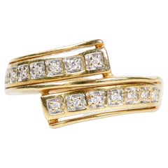 18-carat yellow gold ring decorated with 14 round diamonds of 0.06 carats