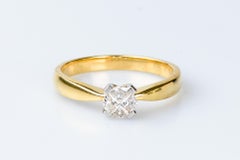 18 carat yellow gold ring designed with 4 pie-cut diamonds