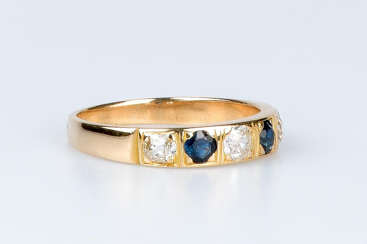 18 carat yellow gold ring designed with round brillant diamonds and sapphires In Excellent Condition For Sale In Monte-Carlo, MC