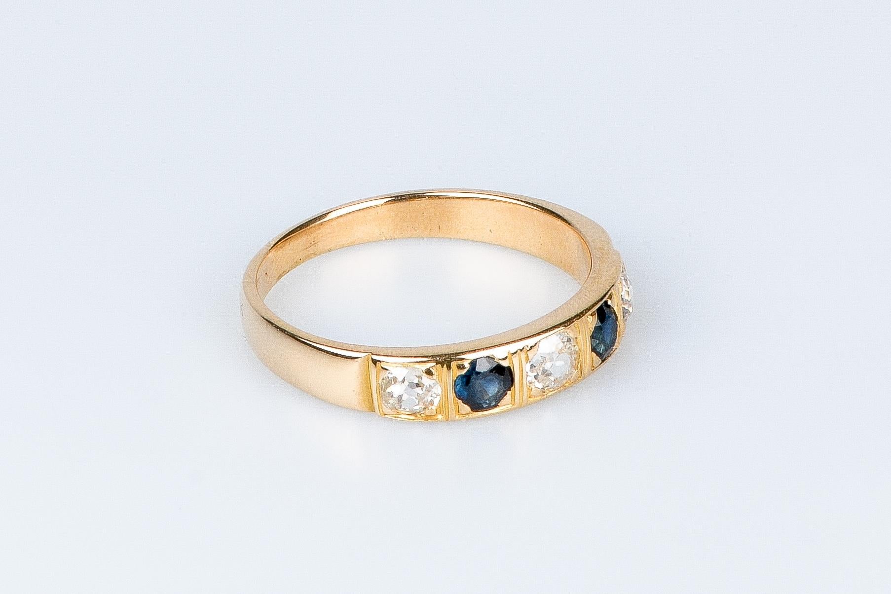 18 carat yellow gold ring designed with round brillant diamonds and sapphires For Sale 1
