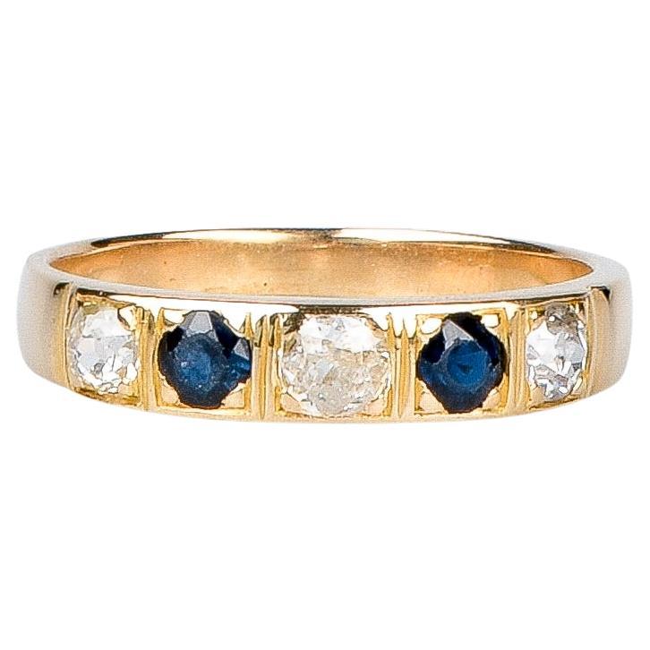 18 carat yellow gold ring designed with round brillant diamonds and sapphires For Sale