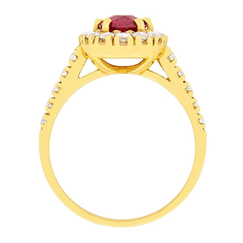 This modern piece of jewellery has a stunning centre ruby, which has been certified by GCS. It is 1.35 carat and is a natural ruby, with no heat treatment. It is then beautifully highlighted by a halo of round brilliant diamonds.

The ruby is a