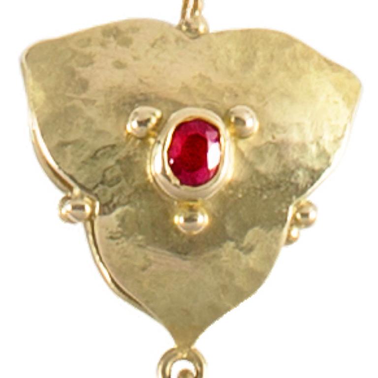 Sophisticated 18 carat yellow gold, pearl and diamond pendant with a sumptuously rich ruby.  Please note this item is made to order and a similar but not identical piece can be made. Allow four weeks to delivery.

Esther Eyre has been designing and