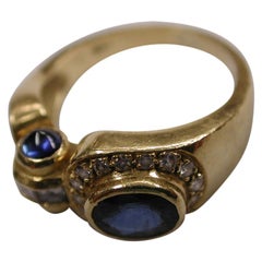 18 Carat Yellow Gold Sapphire and Diamond Ring with Unusual Setting