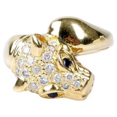 18 carat yellow gold sapphires and zirconium oxides panther ring
