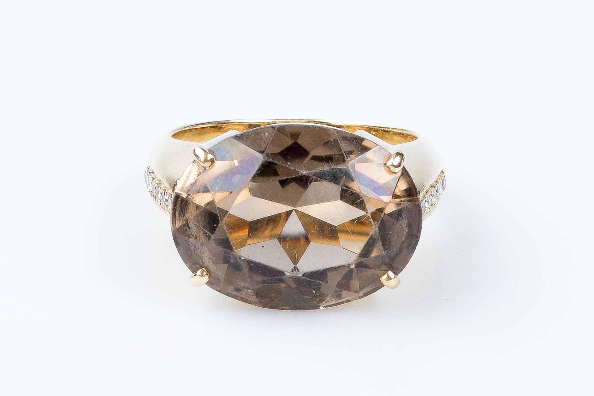 Oval Cut 18 carat yellow gold smoky quartz and diamonds ring For Sale