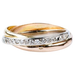 18 carat yellow white and pink gold ring designed with round brillant diamonds