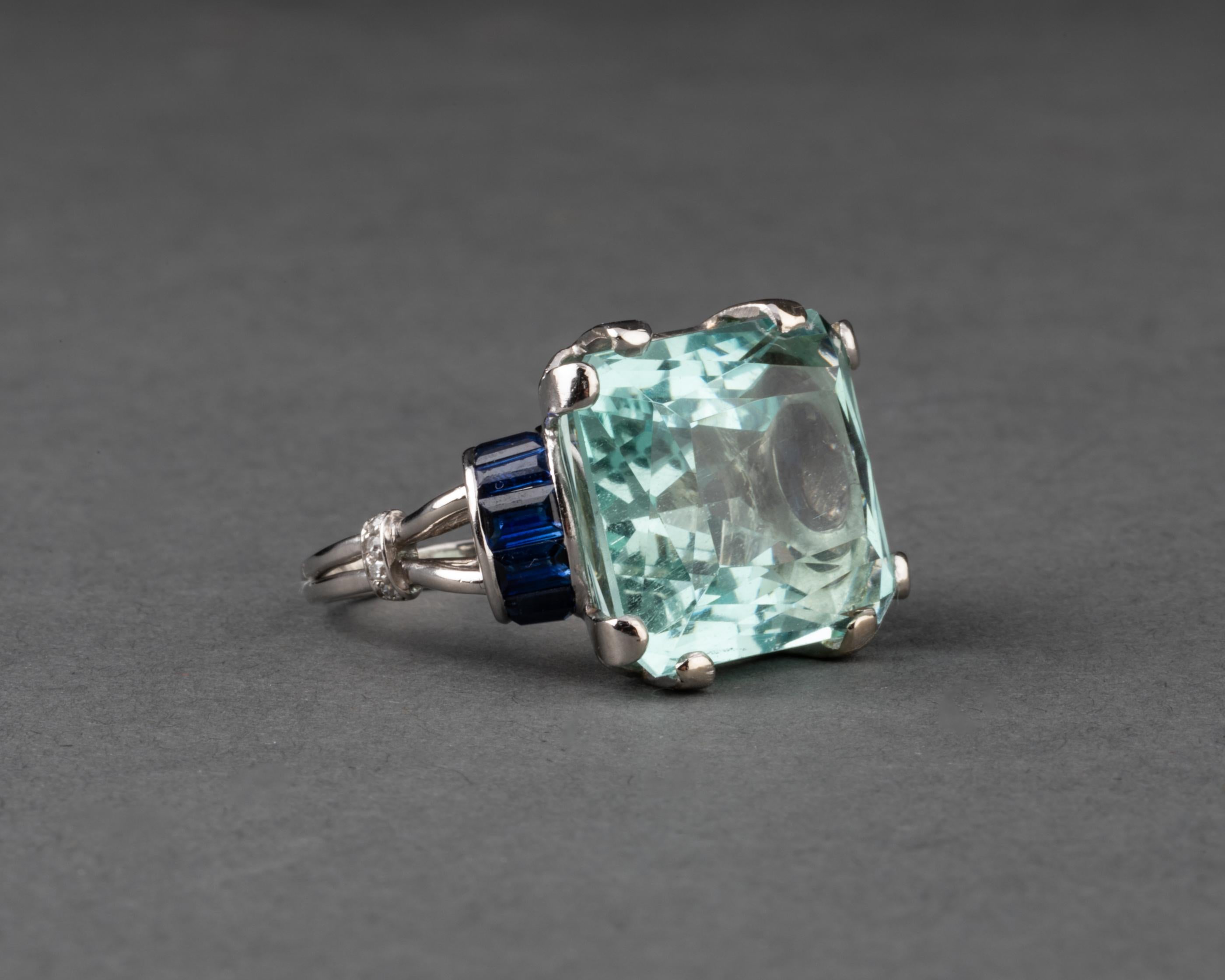 18 Carats Aquamarine and Sapphires French Art Deco Ring 

Very beautiful ring, made in France circa 1930. Made in Platinum.
The craft is quality, the setting of aquamarine is strong with 8 claws.
French hallMark for platinum: the old man
The