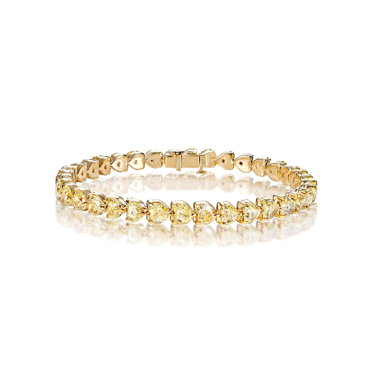 The HOLLAND 18 Carat Single Row Diamond Tennis Bracelet features COMBINE MIX SHAPE DIAMONDS brilliants weighing a total of approximately 18 carats, set in 18K Yellow Gold.

Style:
Diamonds
Diamond Size: 18.36 Carats
Color: Yellow
Diamond Shape: