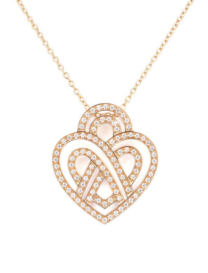 The timeless Poiray collection Cœur Entrelacé is revealed in pure lines, with generous curves, and is dressed in gold or diamonds to celebrate all loves.

Cœur Entrelacé necklace, medium model in rose gold paved with diamonds.

Diamond - 0.4 carat