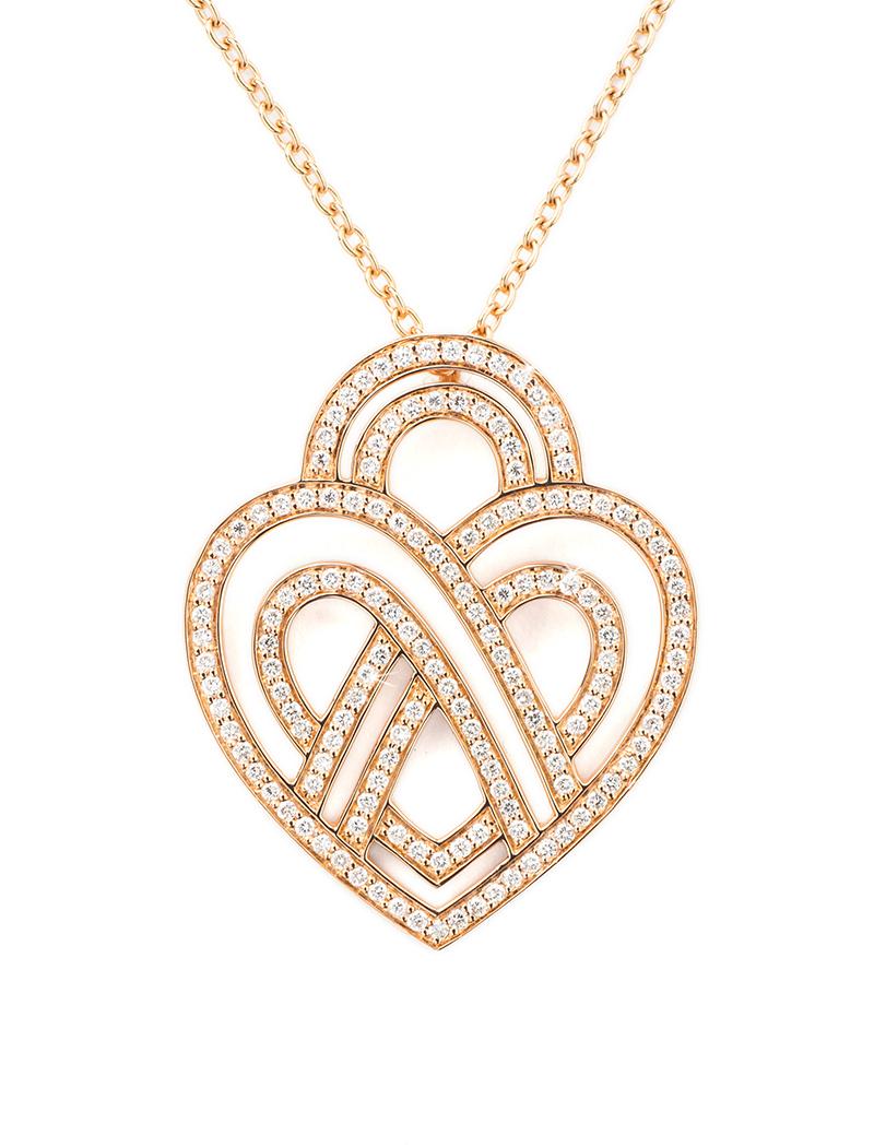 The timeless Poiray collection Cœur Entrelacé is revealed in pure lines, with generous curves, and is dressed in gold or diamonds to celebrate all loves.

Cœur Entrelacé necklace, small model in rose gold paved with diamonds.

Diamond - 0.6 carat