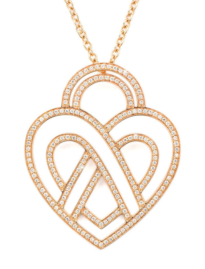 The timeless Poiray collection Cœur Entrelacé is revealed in pure lines, with generous curves, and is dressed in gold or diamonds to celebrate all loves.

Cœur Entrelacé necklace, extra large model in rose gold paved with diamonds.

Diamond - 1.2
