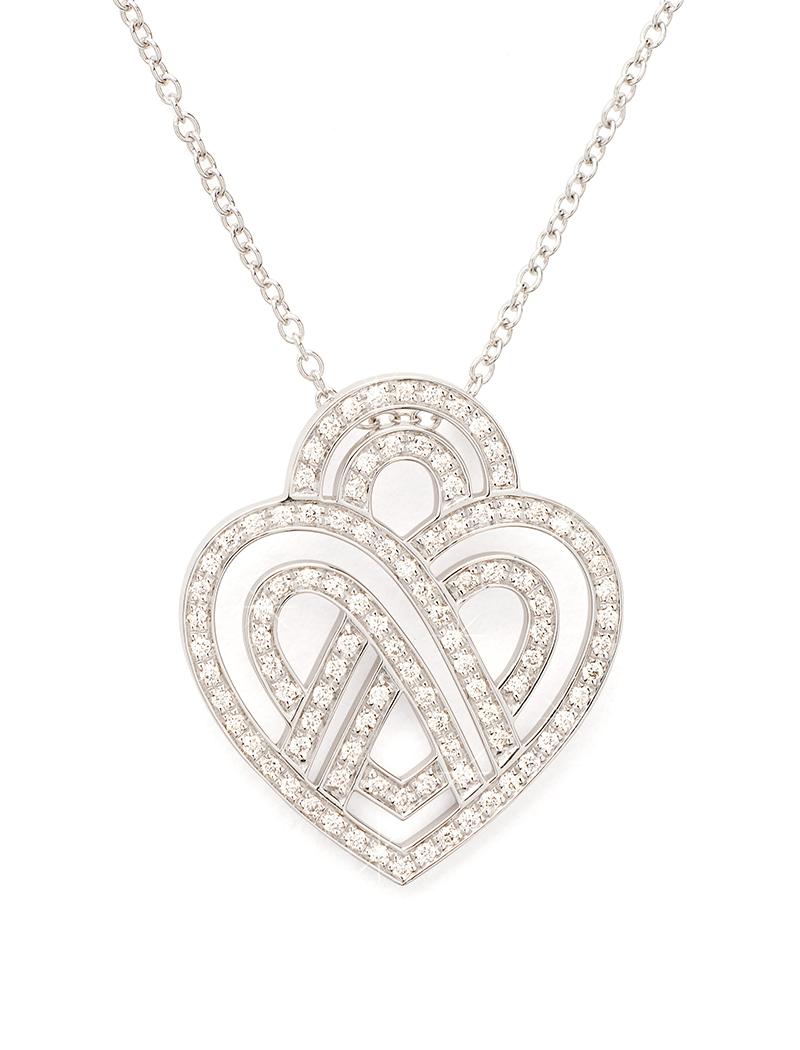 The timeless Poiray collection Cœur Entrelacé is revealed in pure lines, with generous curves, and is dressed in gold or diamonds to celebrate all loves.

Cœur Entrelacé necklace, medium model in white gold paved with diamonds.

Diamond - 0.4 carat