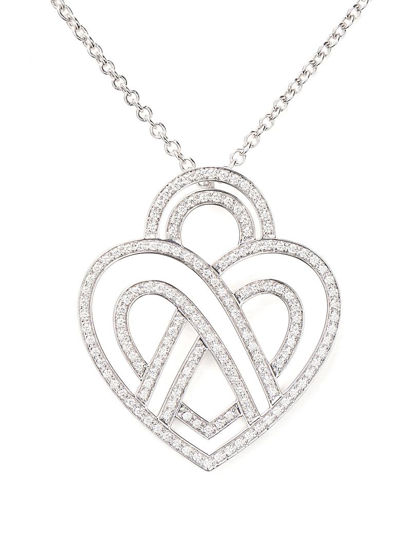 The timeless Poiray collection Cœur Entrelacé is revealed in pure lines, with generous curves, and is dressed in gold or diamonds to celebrate all loves.

Cœur Entrelacé necklace, large model in white gold paved with diamonds.

Diamond - 0.6 carat