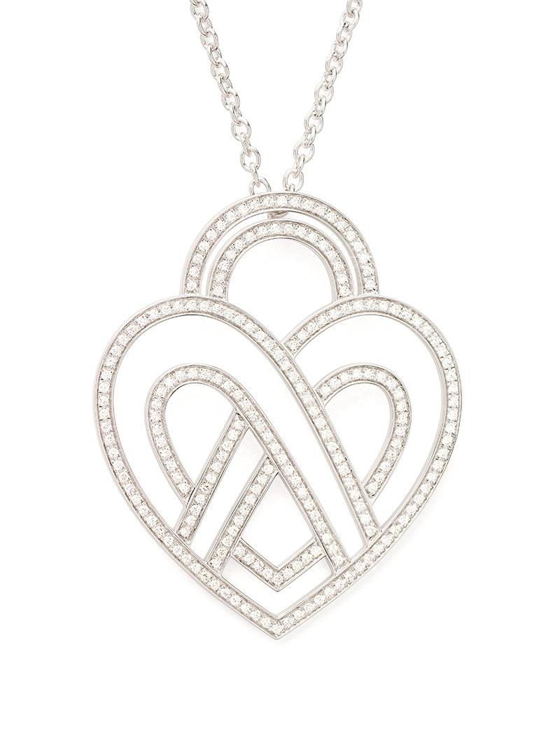 The timeless Poiray collection Cœur Entrelacé is revealed in pure lines, with generous curves, and is dressed in gold or diamonds to celebrate all loves.

Cœur Entrelacé necklace, extra large model in white gold paved with diamonds.

Diamond - 1.2