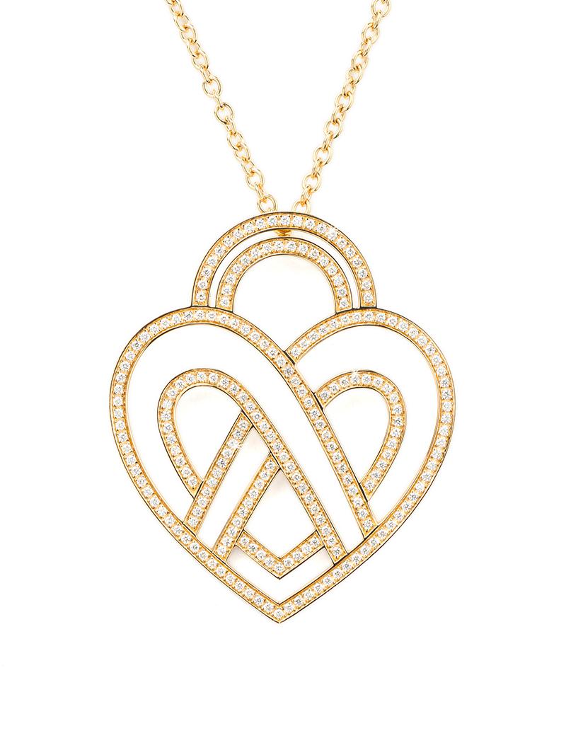 The timeless Poiray collection Cœur Entrelacé is revealed in pure lines, with generous curves, and is dressed in gold or diamonds to celebrate all loves.

Cœur Entrelacé necklace, extra large model in yellow gold paved with diamonds.

Diamond - 1.2