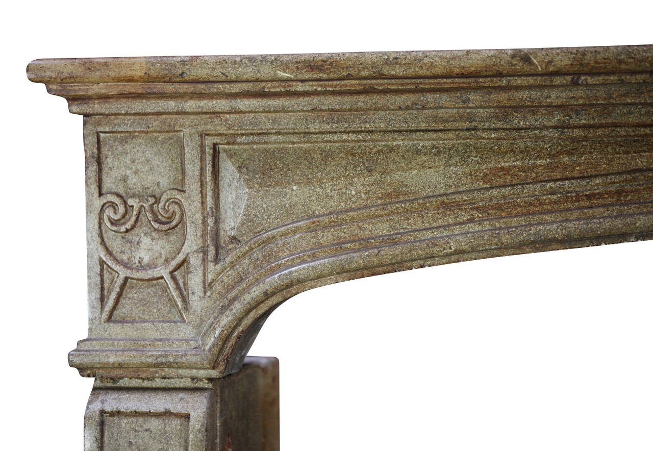 This is a strong original European fireplace surround in dark brown hard stone. The baguette details are a sign of wealth. The mantel (fireplace) has exceptional proportions The figurative element in the center of the fronton is an extra