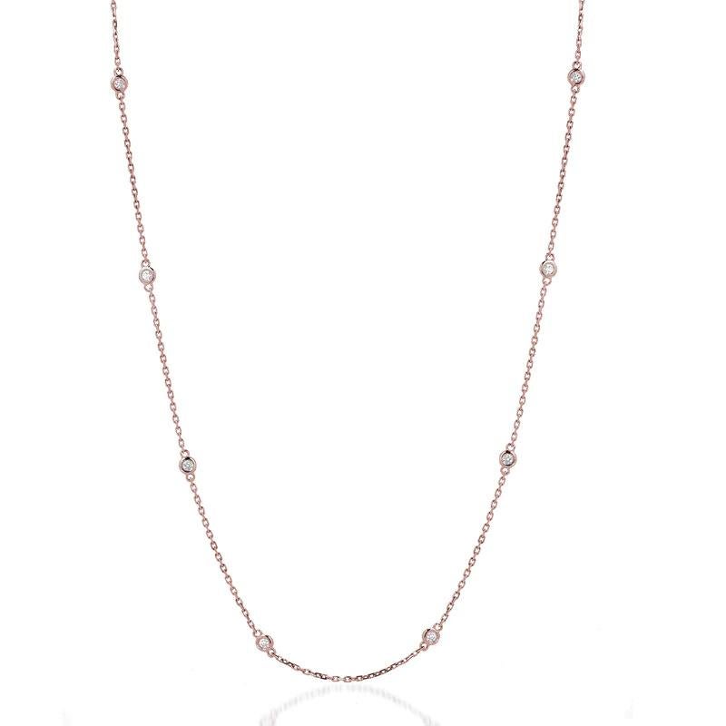 Otto eleganti diamanti rotondi incastonati in un castone lungo una collana a catena in oro 14k.

Oro: Oro 14K
Numero di diamanti: Otto
Oro Colore: Oro rosa
Carati: 1 Carato
Lunghezza della collana: 18 pollici
Chiarezza del diamante: VS
Colore del