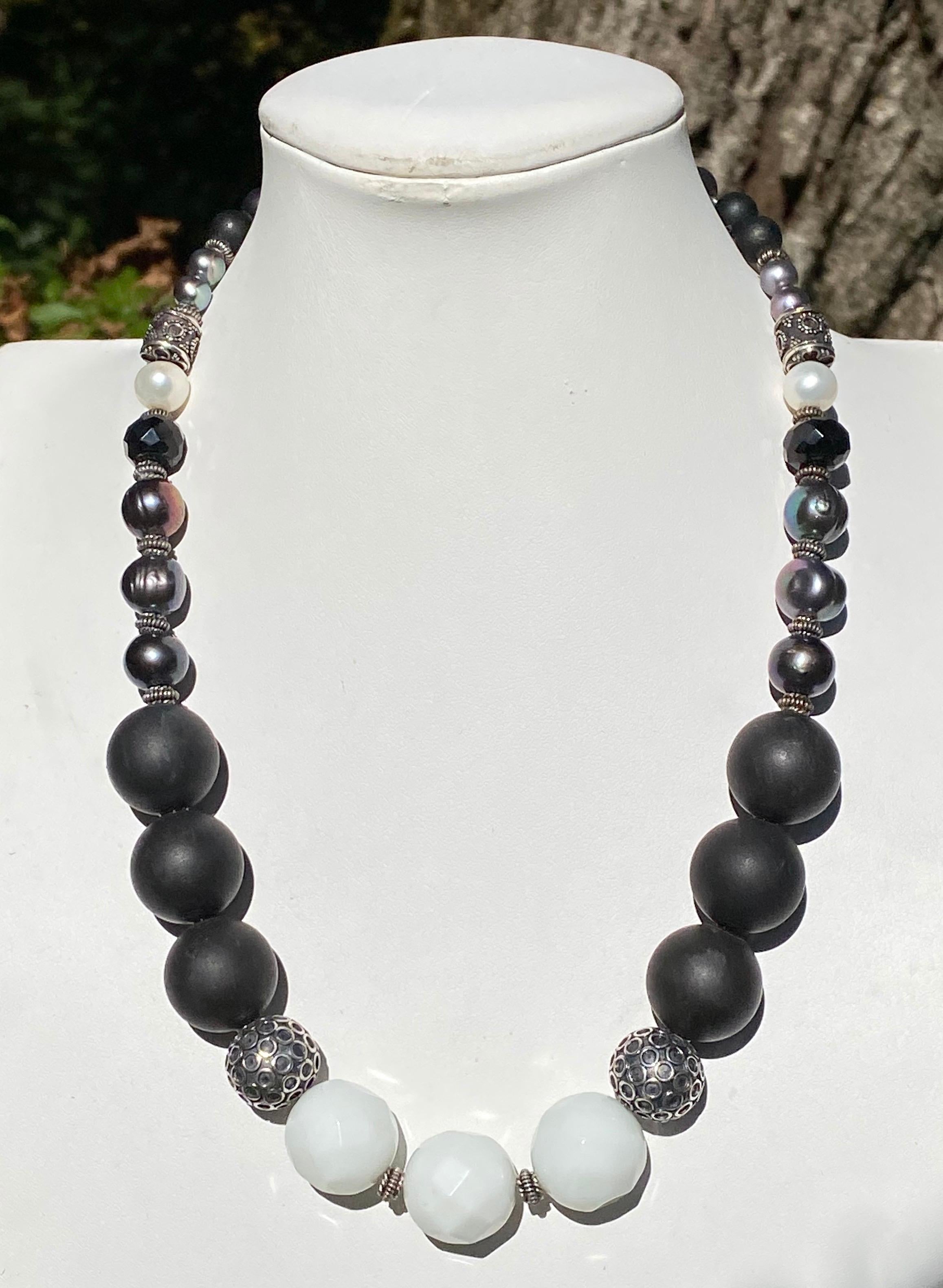 Funky Indian inspired necklace with large faceted White Agate Beads, Large Black Onyx Beads, Freshwater Dyed Black Pearls, and 2 White Freshwater Cultured Pearls with Sterling Silver Rondelles and decorative round and barrel spacers, all with a