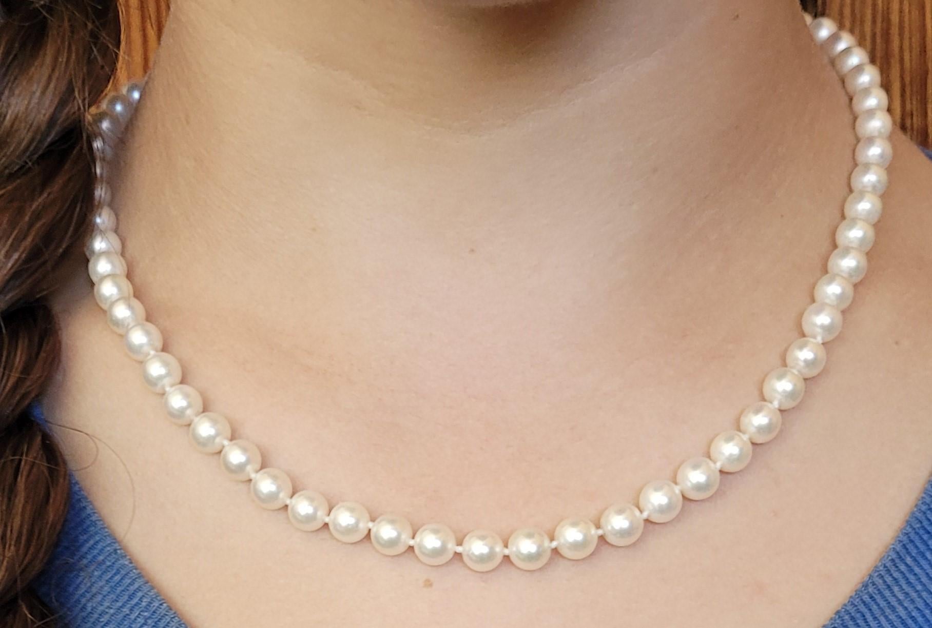 Modern 18 Inch Cultured White Pearl Strand, 6.5mm Pearls, 14kt Yellow Gold Clasp, Knot For Sale