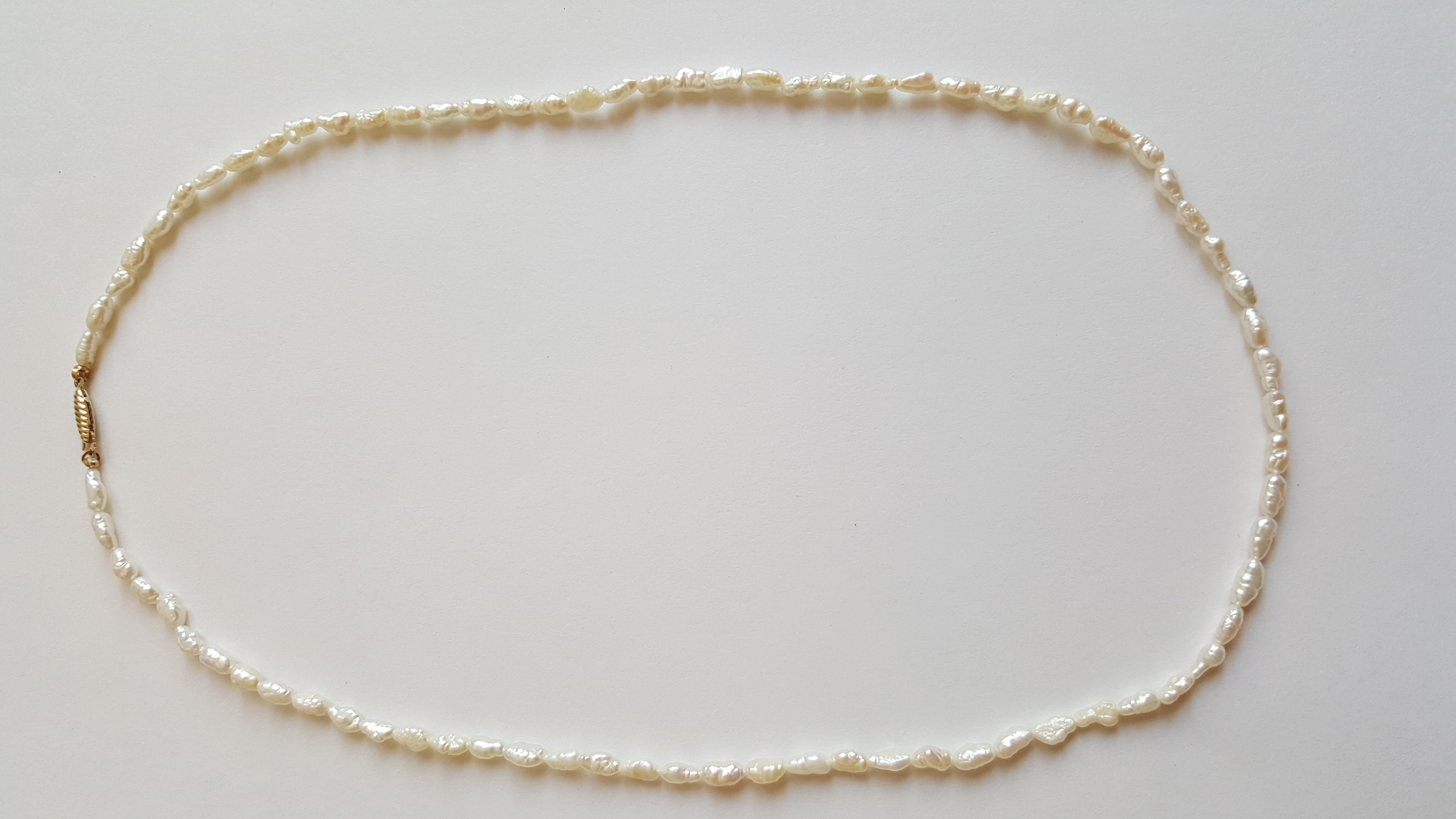 White Freshwater Pearl Strand with 14kt Yellow Gold Pearl Clasp In Good Condition For Sale In Rancho Santa Fe, CA