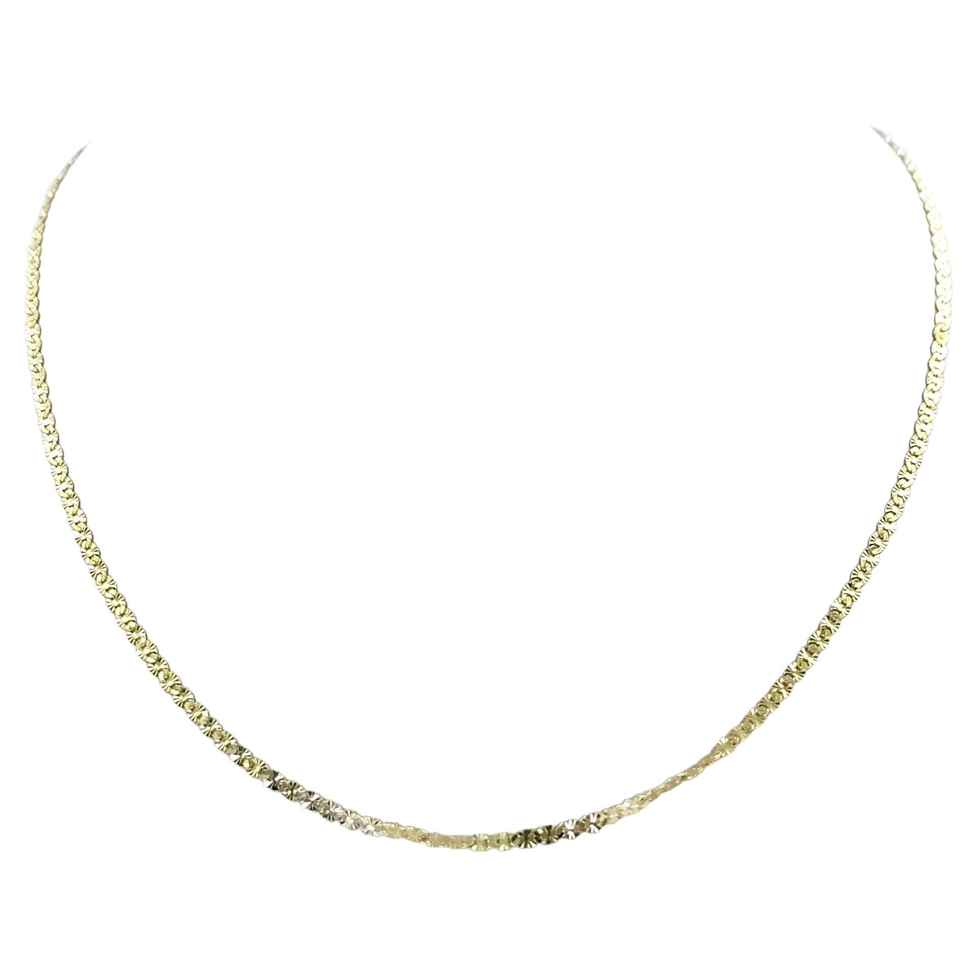 14 Karat Yellow Gold 0.8mm Flat Textured Anchor Link Chain Measuring 18 Inches Long. Finished Weight is 1.7 Grams.