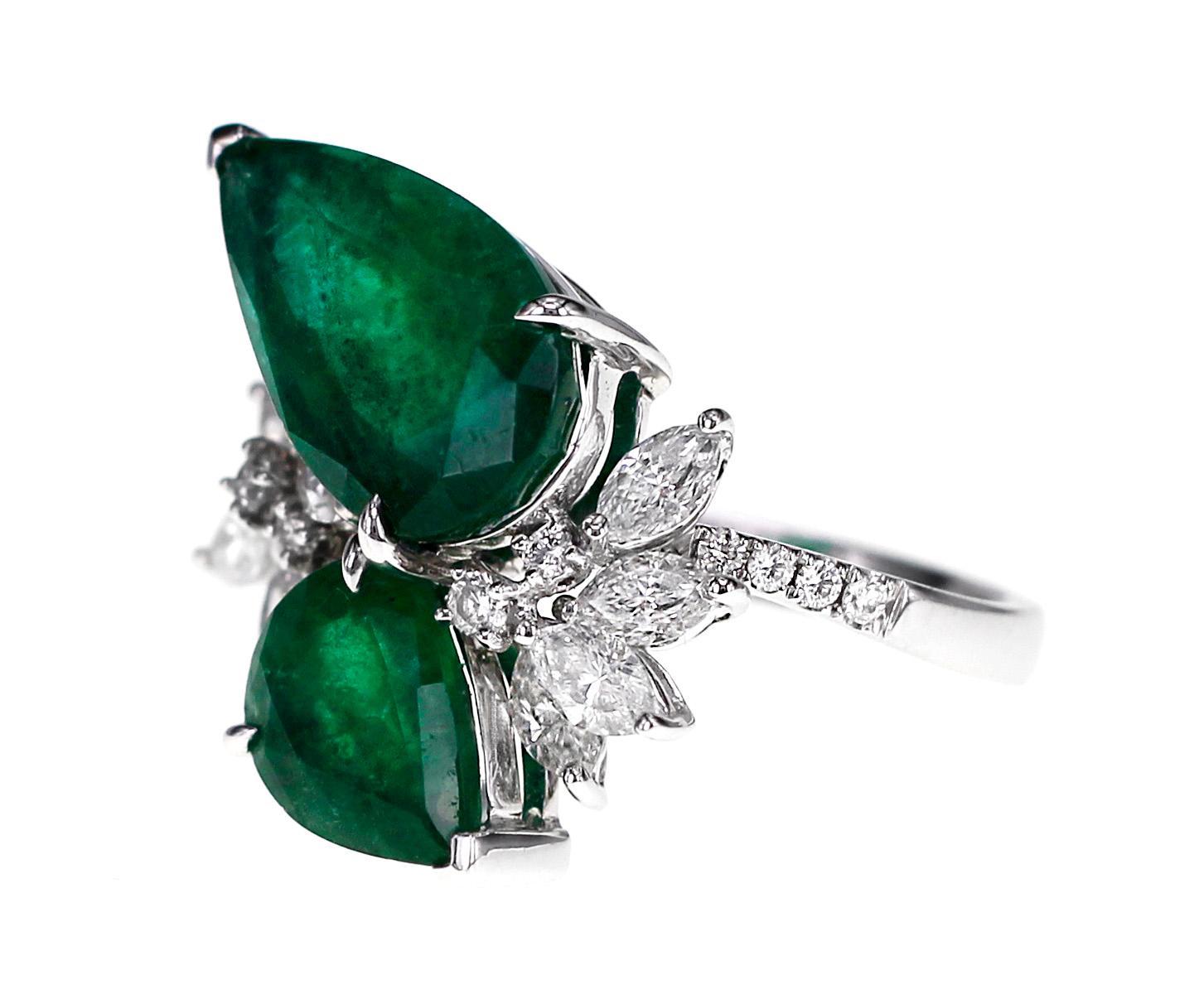 6.67 carats of Vivid green emeralds are set along with 1.35 carat of white brilliant diamonds. Hand picked F color and VS clarity diamonds are set along with this deep saturation emeralds.
Ring Size: US 6.25