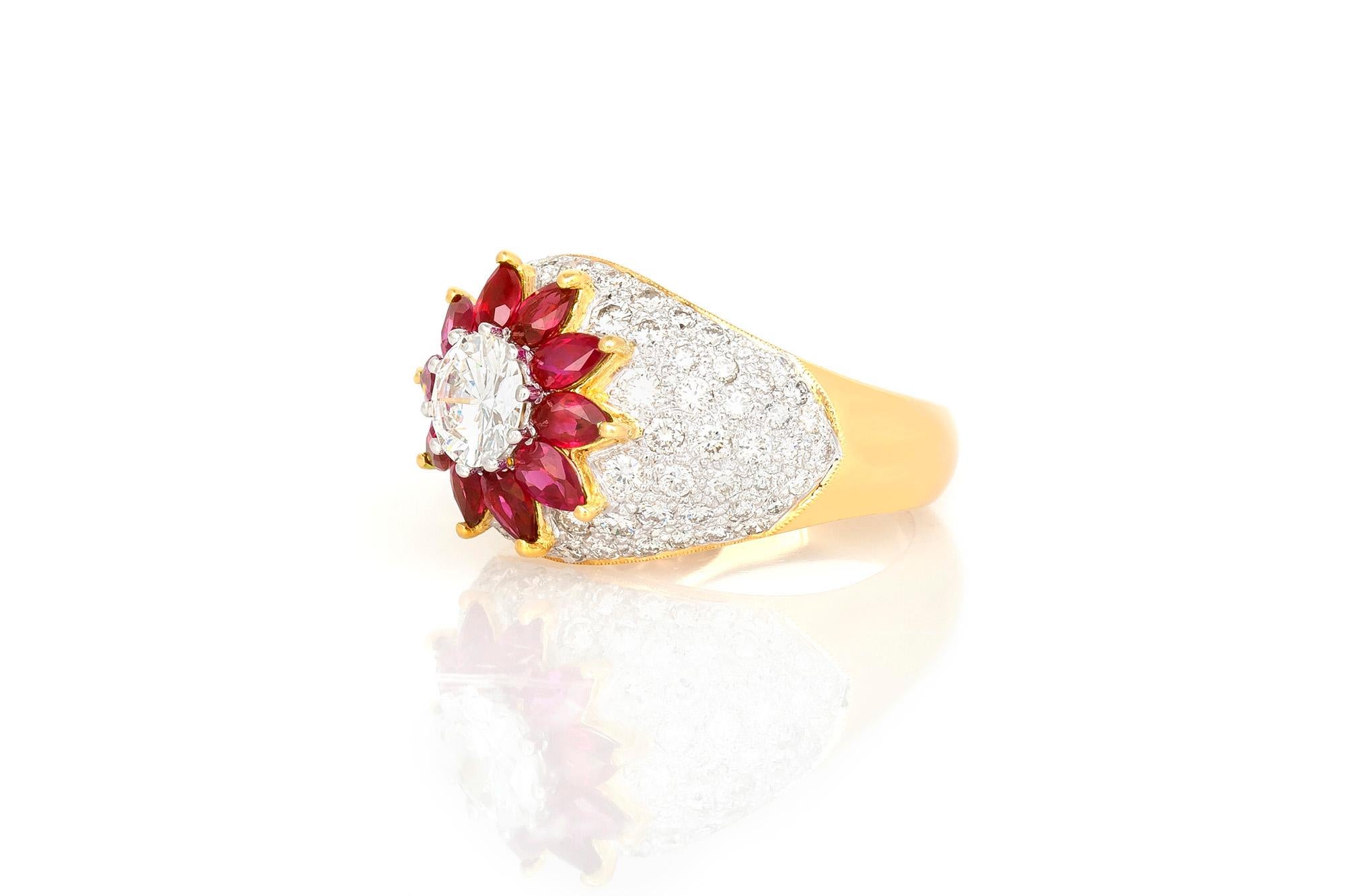 Ring finely crafted in 18K yellow gold with center diamond weighing approximately 0.80 carat.
Pair shaped Rubies weighing approximately 1.80 carat. 
The diamonds around the Ruby weigh approximately 2.00 carat.
The ring size is 6.5 US and 53 EU