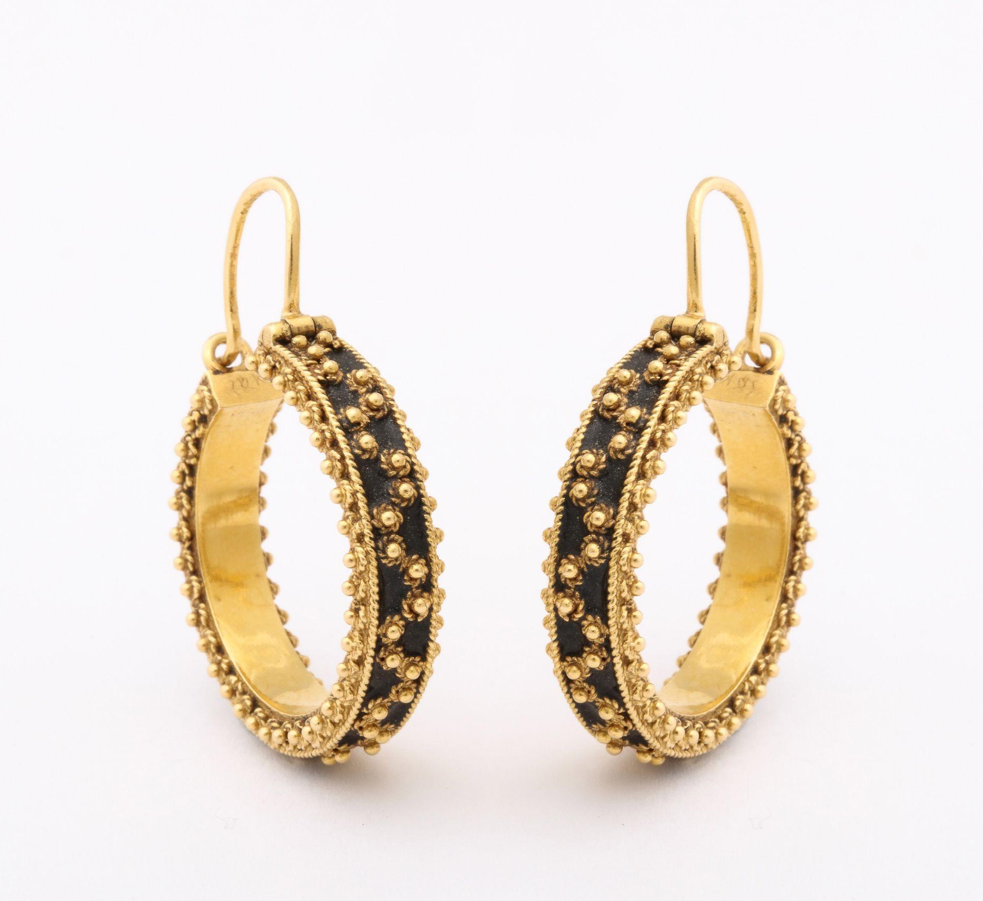 A pair of 18 k Gold Beaded Hoop Earrings with gold beads over ebonized center
