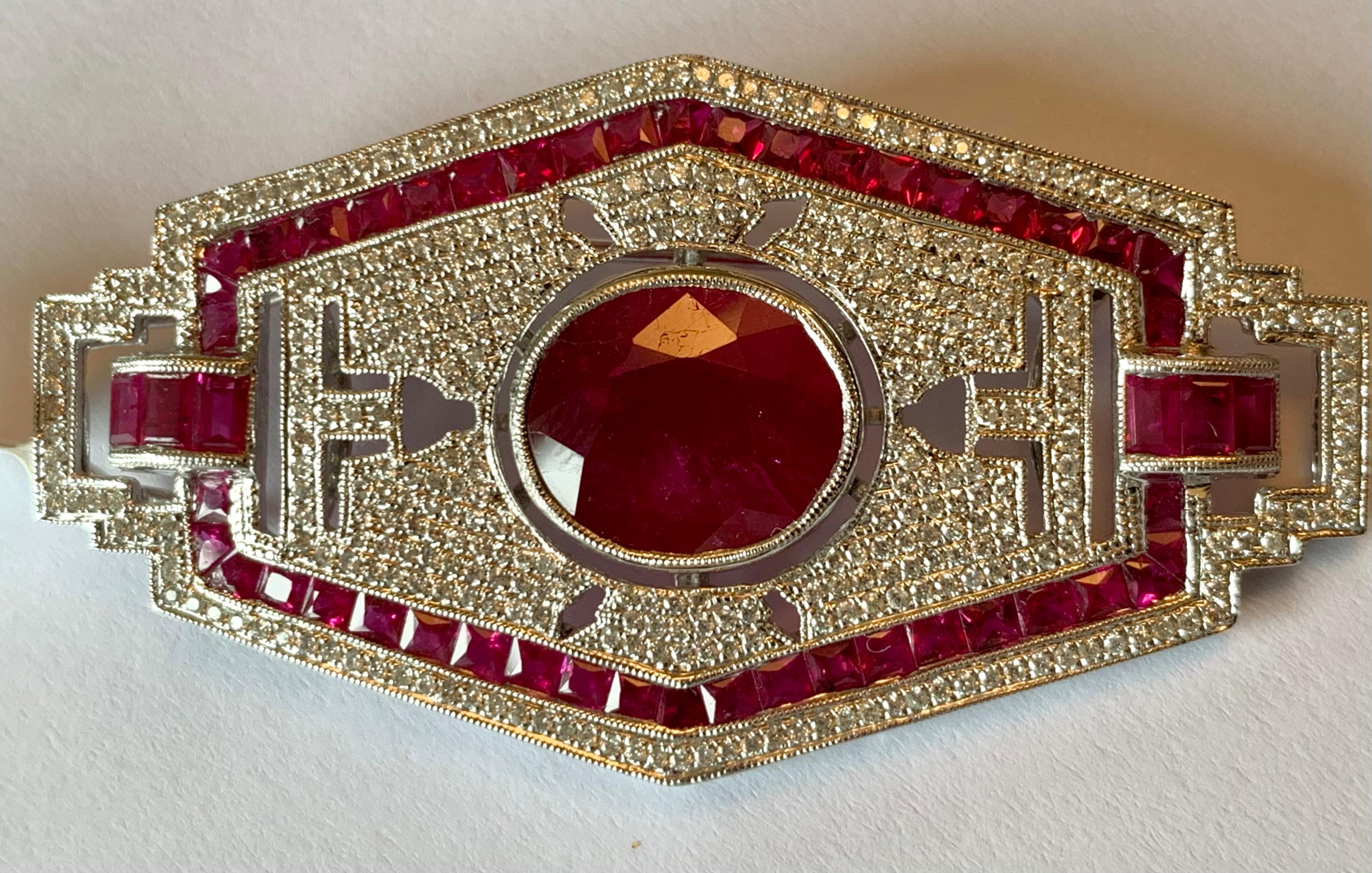 Very attractive new 18 K white Gold brooch/pendant inspired by the glamorous Art Deco era featuring 53 rubies weighing 8.30 ct and 374 brilliant cut Diamonds weighing 1.05 ct. 
