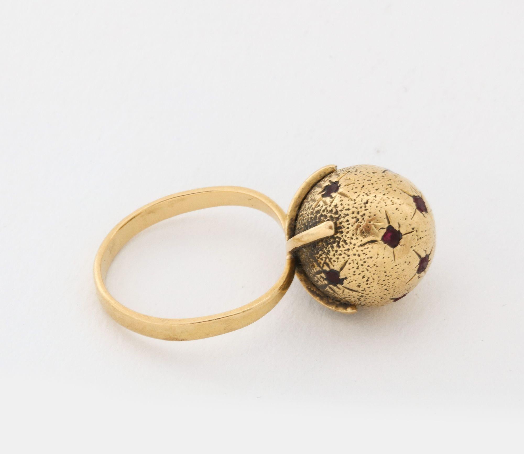 Modernist 18 k Gold Sphere / Globe Ring with Star-set Rubies For Sale
