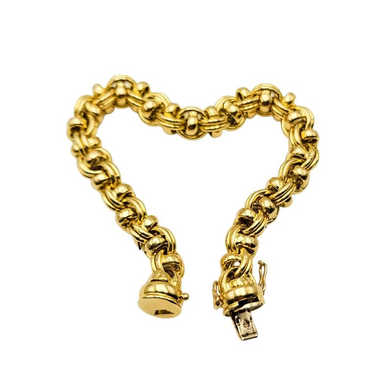 18 K Gold Italian-made barrel link style bracelet with barrel clasp double figure eight safety clasps.
27.26 grams of 18 K yellow gold.  7 3/4 inches long. 