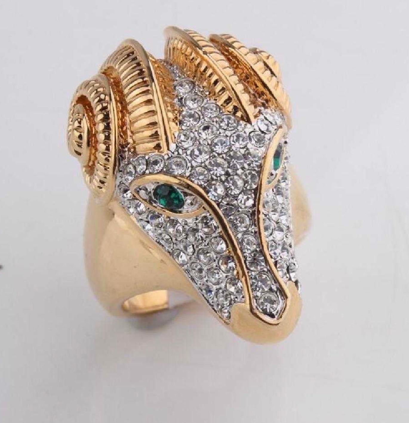 Impressive Large Ram Head Ring made to Impress!

Beautiful Ram Head 18k Gold Plated Ring: Size:9
CZ Pave Face with Faux Emerald Eyes
very good condition