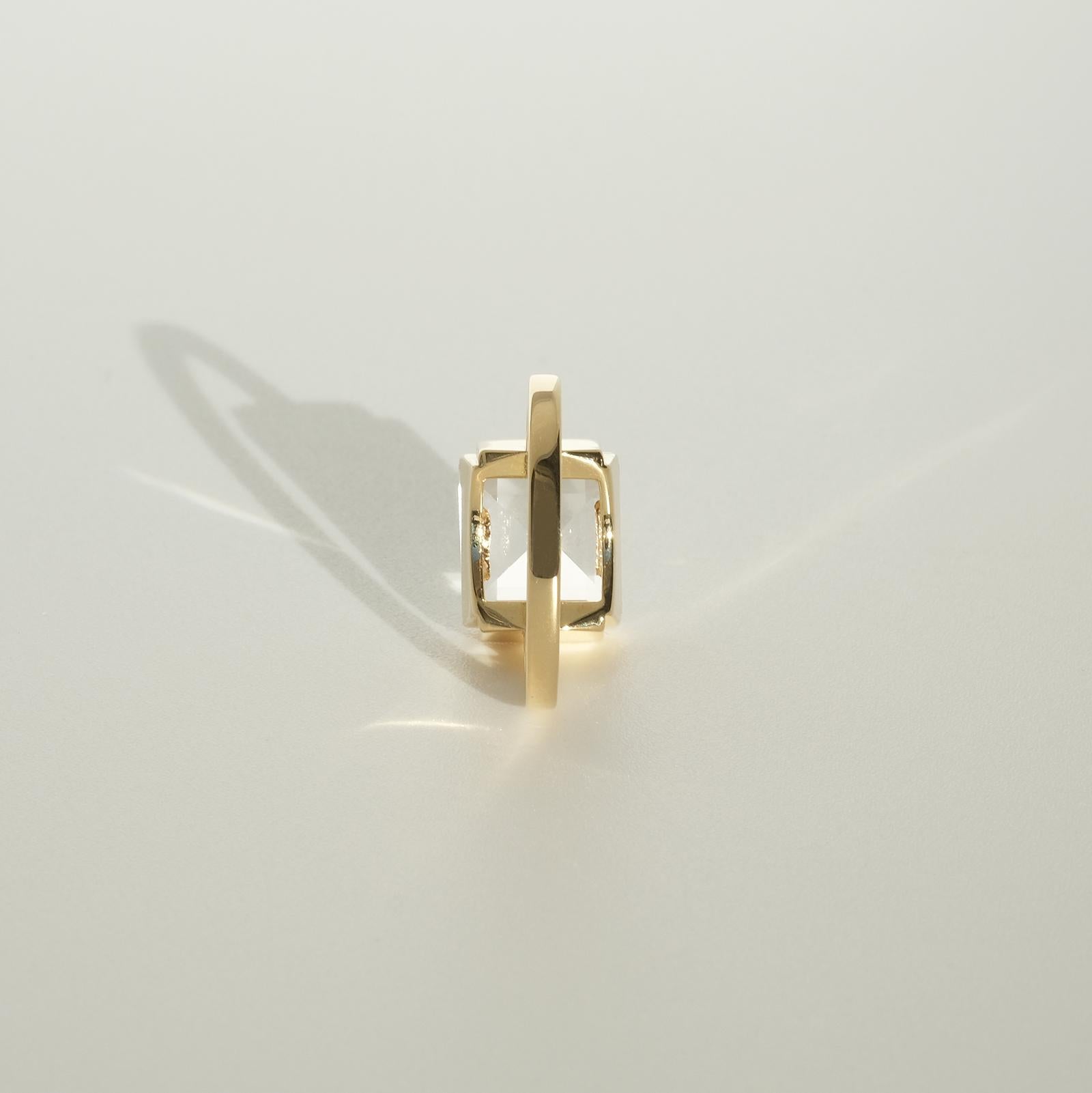 This 18 karat gold and rock crystal ring has a square faceted rock crystal and a stair shaped setting. The ring, with its geometric and stylish forms, shows upon typical Wiwen Nilsson characteristics. 

The ring radiates class and style and fits