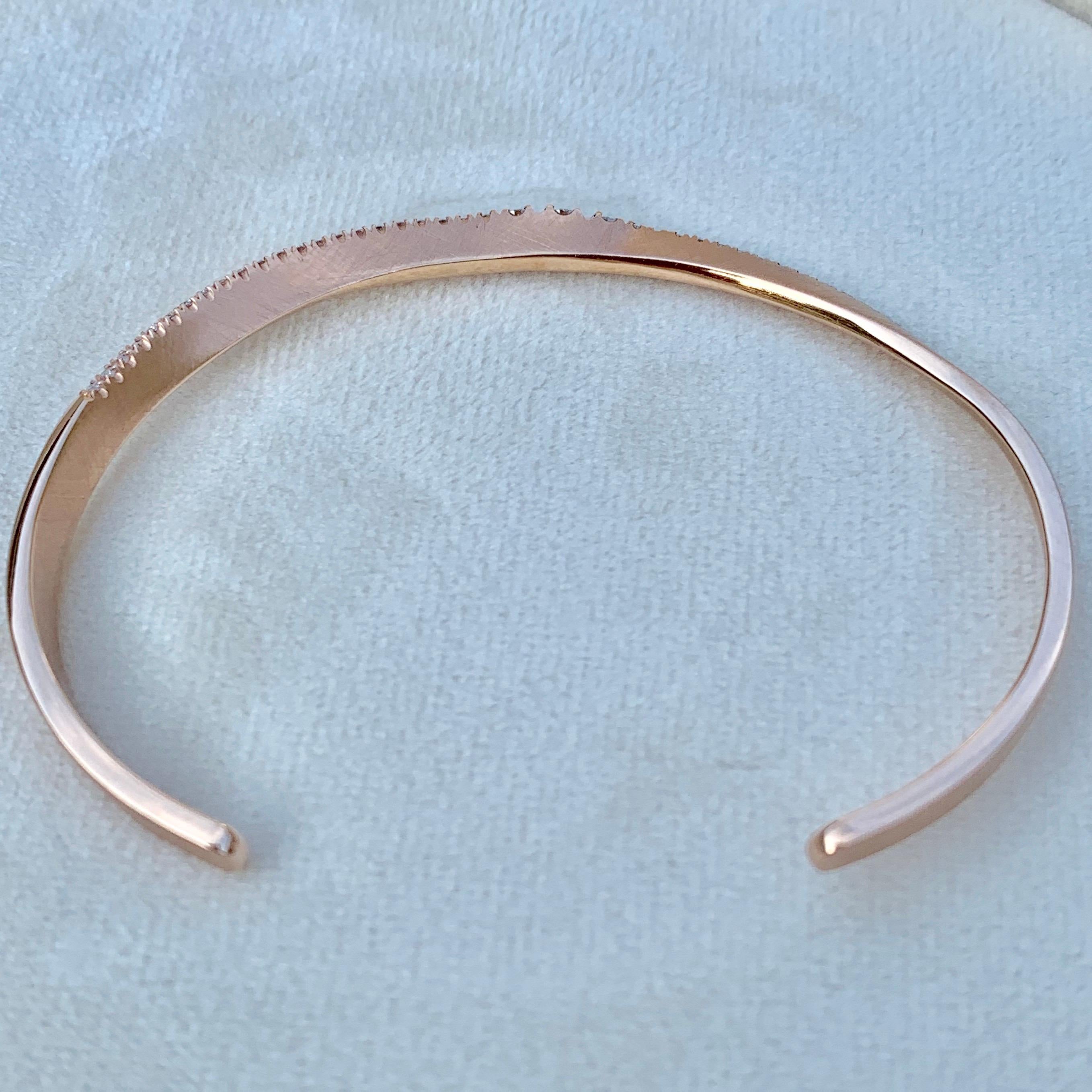 Handmade Arm cuff in 18K matte rose gold 12,9 g, set with brilliant cut diamonds FVVS 0,73 ct. Full gold bracelet outer dimensions: 48mm X 62mm, wire:  4mm x 1,72mm. Euphoria collection. 
This exquisite product comes from Joke Quick, a jewellery