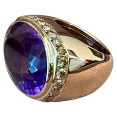 Anillo de oro rosa de 18 K con amatista y diamante champán