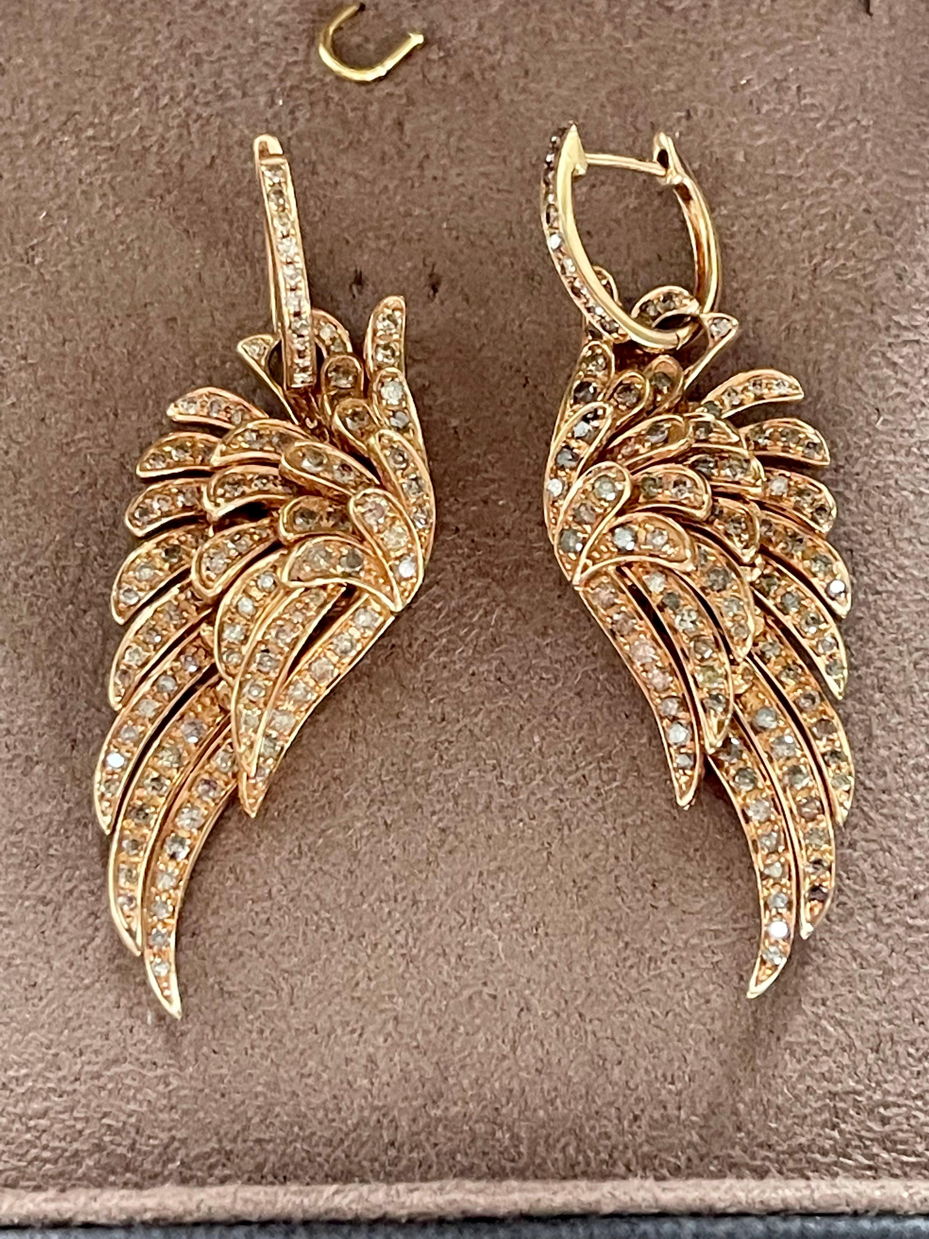 A pair of lovely 18 K rose Gold Angel wing earrings featuring 206 brown brilliant cut Diamonds weighing 1.71 ct. 
Masterfully handcrafted piece! Authenticity and money back is guaranteed.
For any enquires, please contact the seller through the