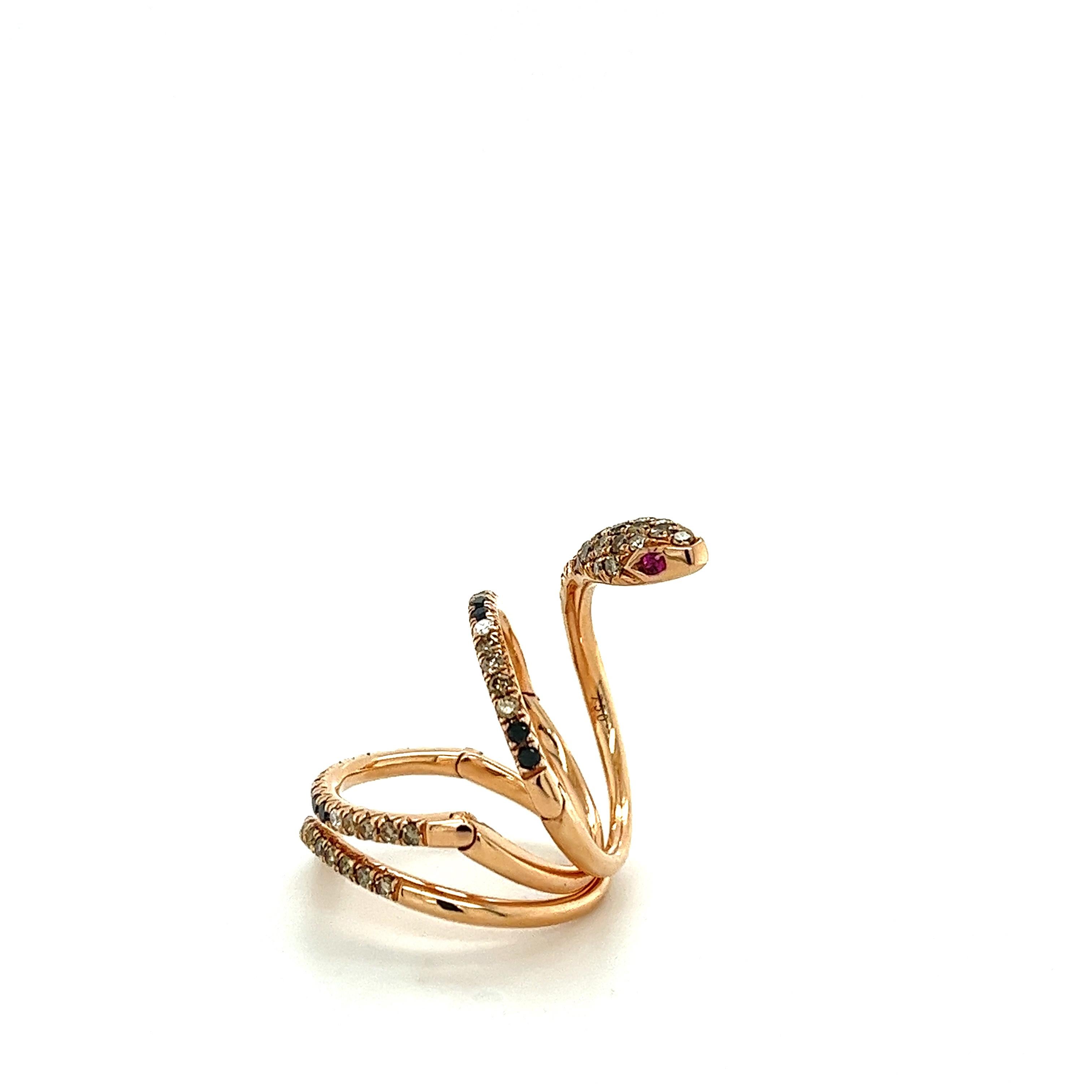 18 K Rose Gold Black Diamonds & Brown Diamonds Snake Ring 

50 Brown Diamonds 0.82 CT
16 Black Diamonds 0.25 CT
6 Diamonds 0.07 CT
2 Rubies 0.04 CT
18 K Rose Gold 8.76 GM

The diamond means clarity, truth, and vision. Handicrafters made this noble